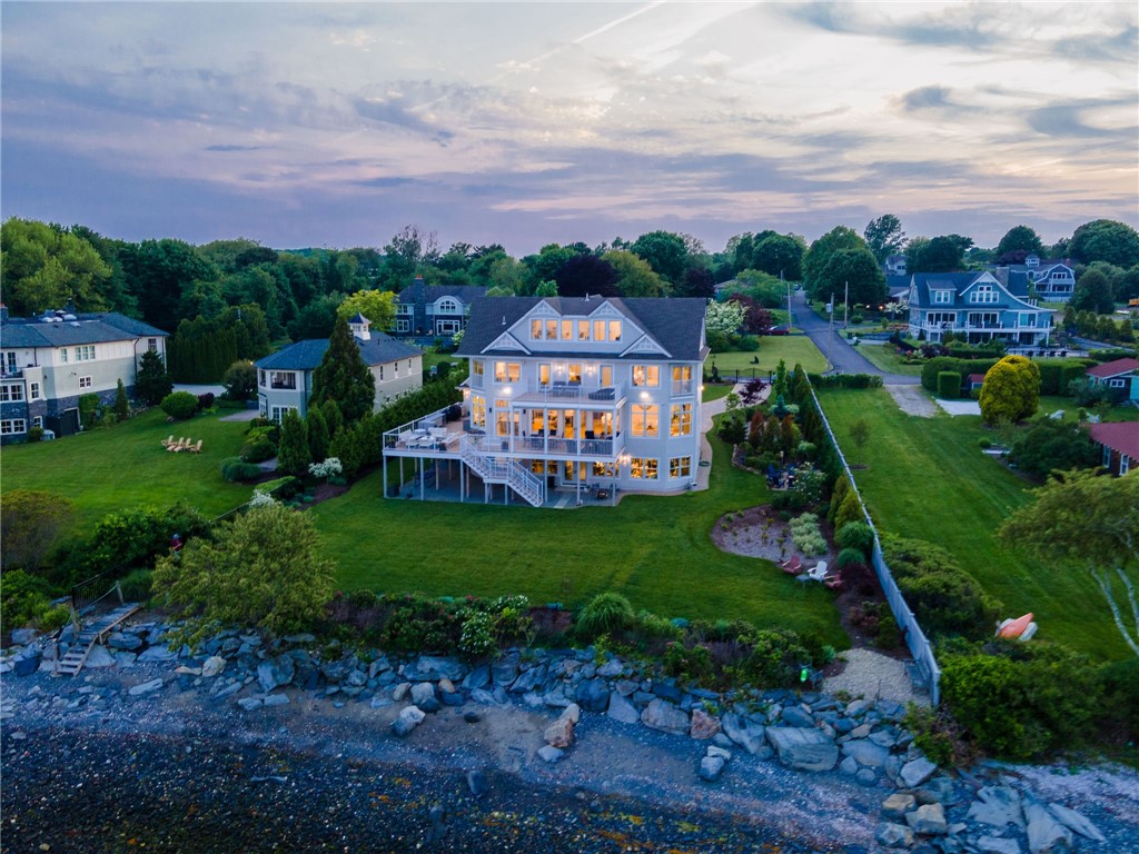 10 Coulter Street Jamestown, RI 02835 - Photo 2 of 48 Waterside view of the home at twilight.