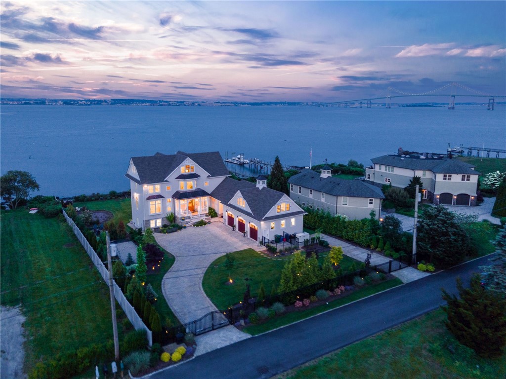 10 Coulter Street Jamestown, RI 02835 - Photo 41 of 48 Aerial view of the front of the home showing the gated entrance, 3-car garage, and exquisite plantings and landscape lighting.