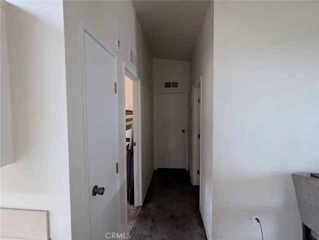 a view of a bathroom from a hallway