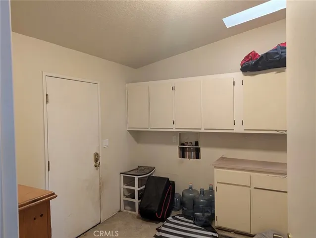 a view of cabinets with washer and dryer