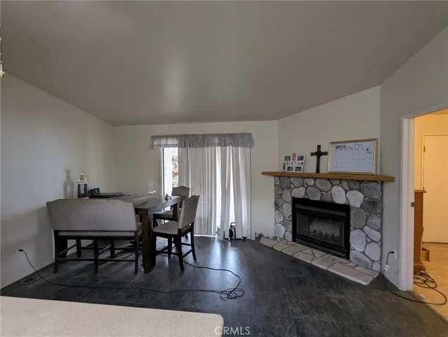 a view of a livingroom with furniture and a fireplace
