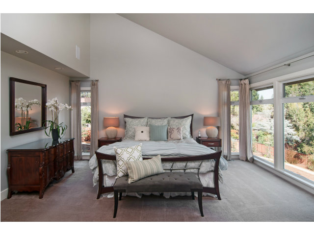 361 Ridgeway Road Woodside, CA 94062 - Photo 10 of 21 a bedroom with a bed a large window with table and chair