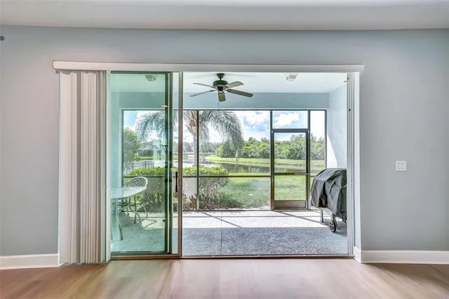 a view of a room that has a bed and a large window