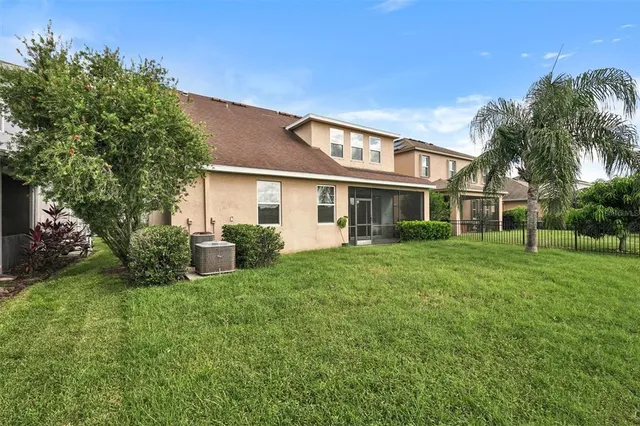 a view of a lake with houses in the background