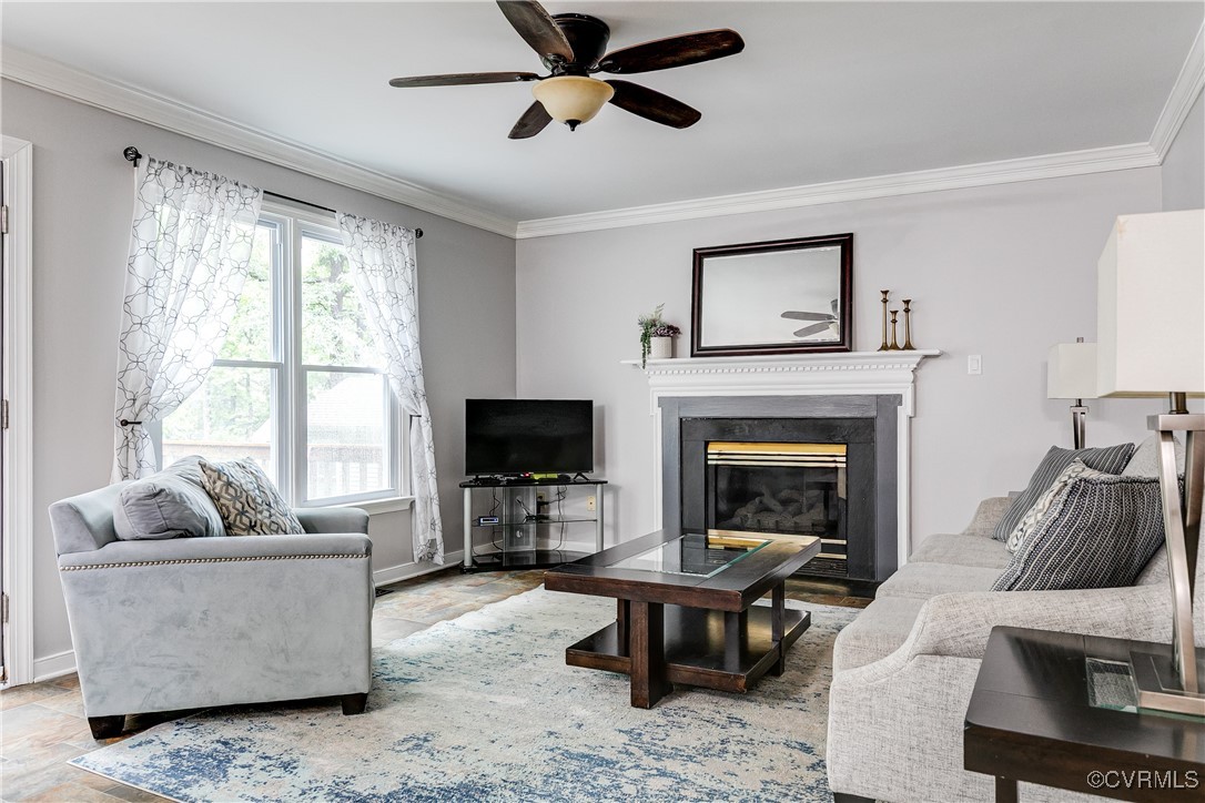 5809 Rosebay Forest Road Midlothian, VA 23112 - Photo 11 of 48 a living room with furniture a flat screen tv and a fireplace