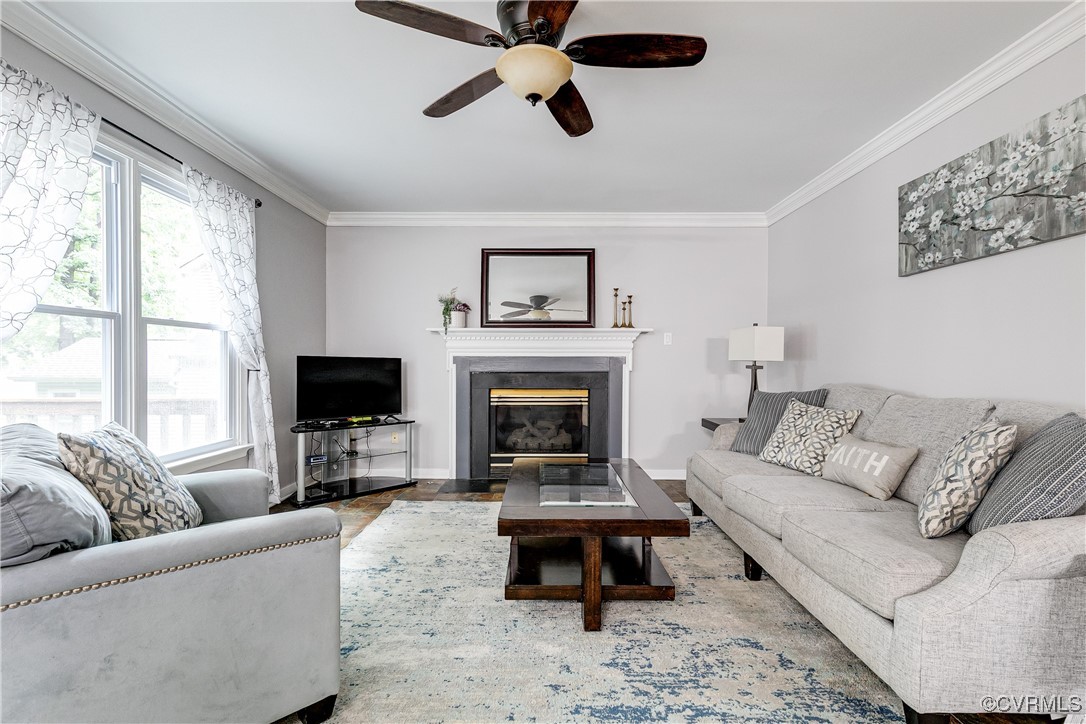 5809 Rosebay Forest Road Midlothian, VA 23112 - Photo 12 of 48 a living room with furniture a rug and a fireplace
