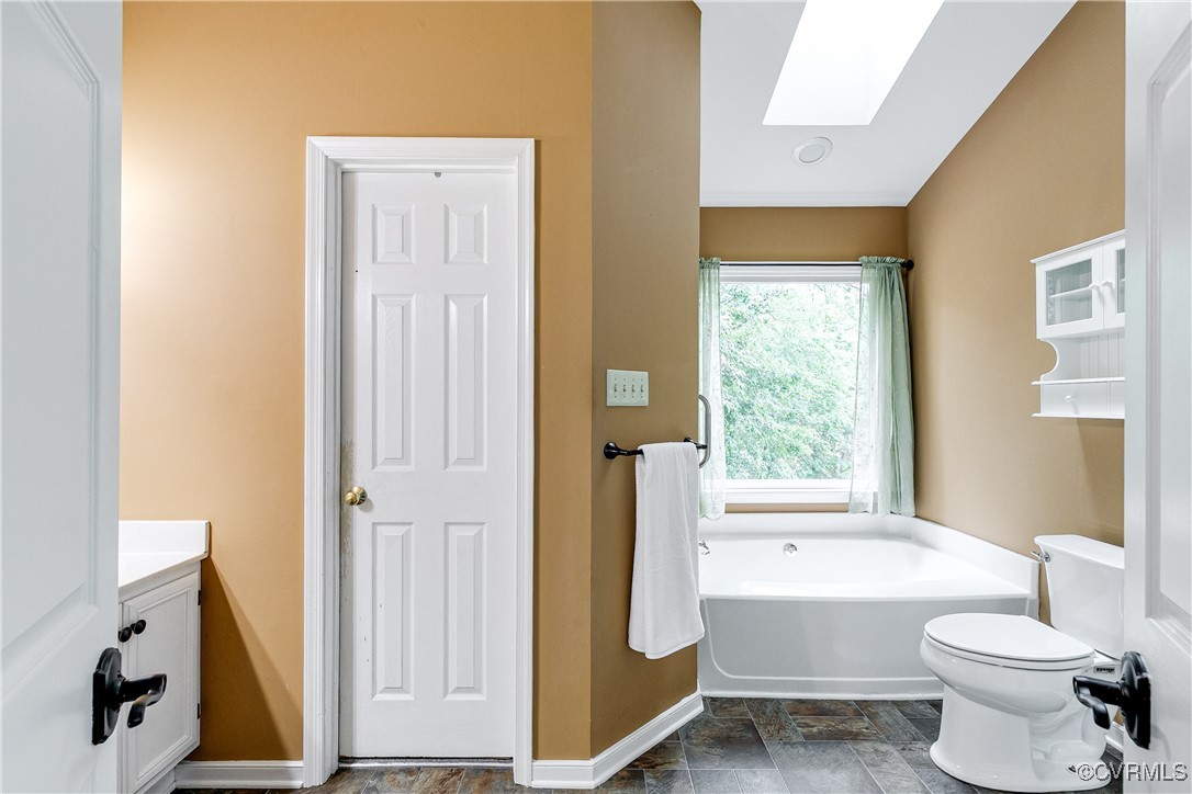 5809 Rosebay Forest Road Midlothian, VA 23112 - Photo 28 of 48 a bathroom with a toilet a sink and a mirror