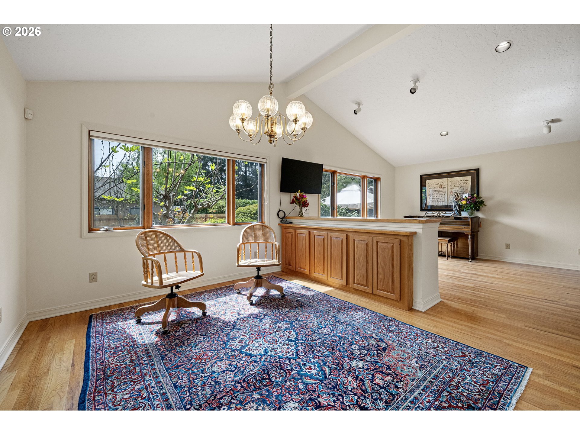 84 Green Lane Eugene, OR 97404 - Photo 18 of 41 a view of a livingroom with furniture a flat screen tv and wooden floor