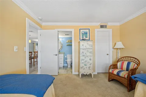 a bedroom with a bed and a view of bathroom