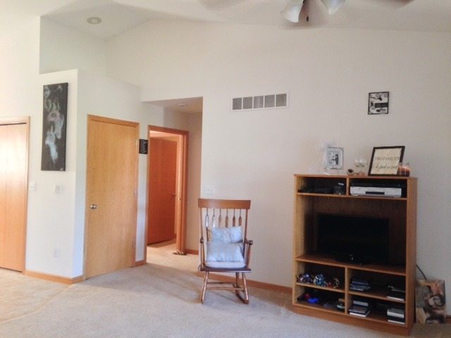 212 Finley Circle Grand Ridge, IL 61325 - Photo 6 of 11 a living room with furniture and a flat screen tv