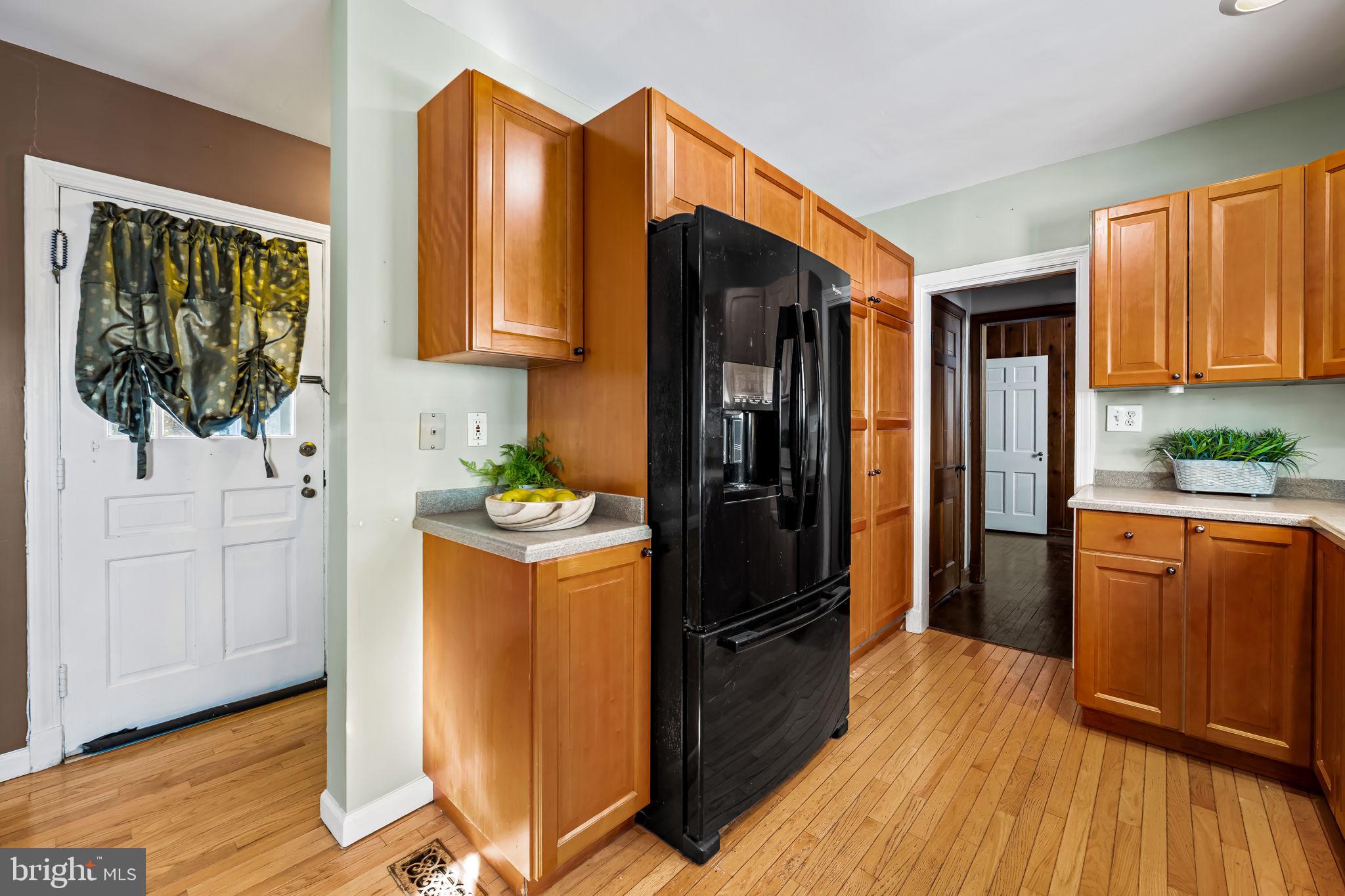 3022 Dunglow Road Baltimore, MD 21222 - Photo 12 of 45 a kitchen with stainless steel appliances a refrigerator and a stove top oven