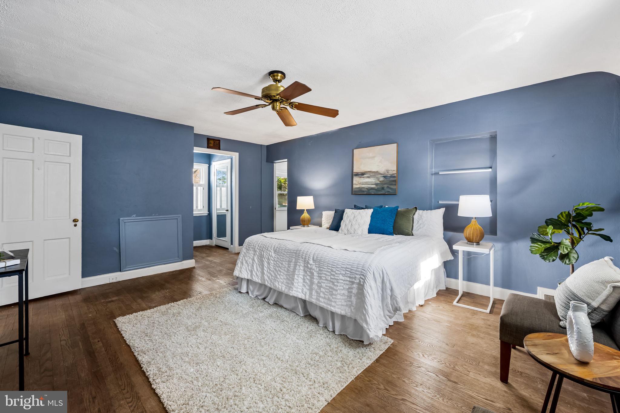 3022 Dunglow Road Baltimore, MD 21222 - Photo 21 of 45 a bedroom with a bed and wooden floor
