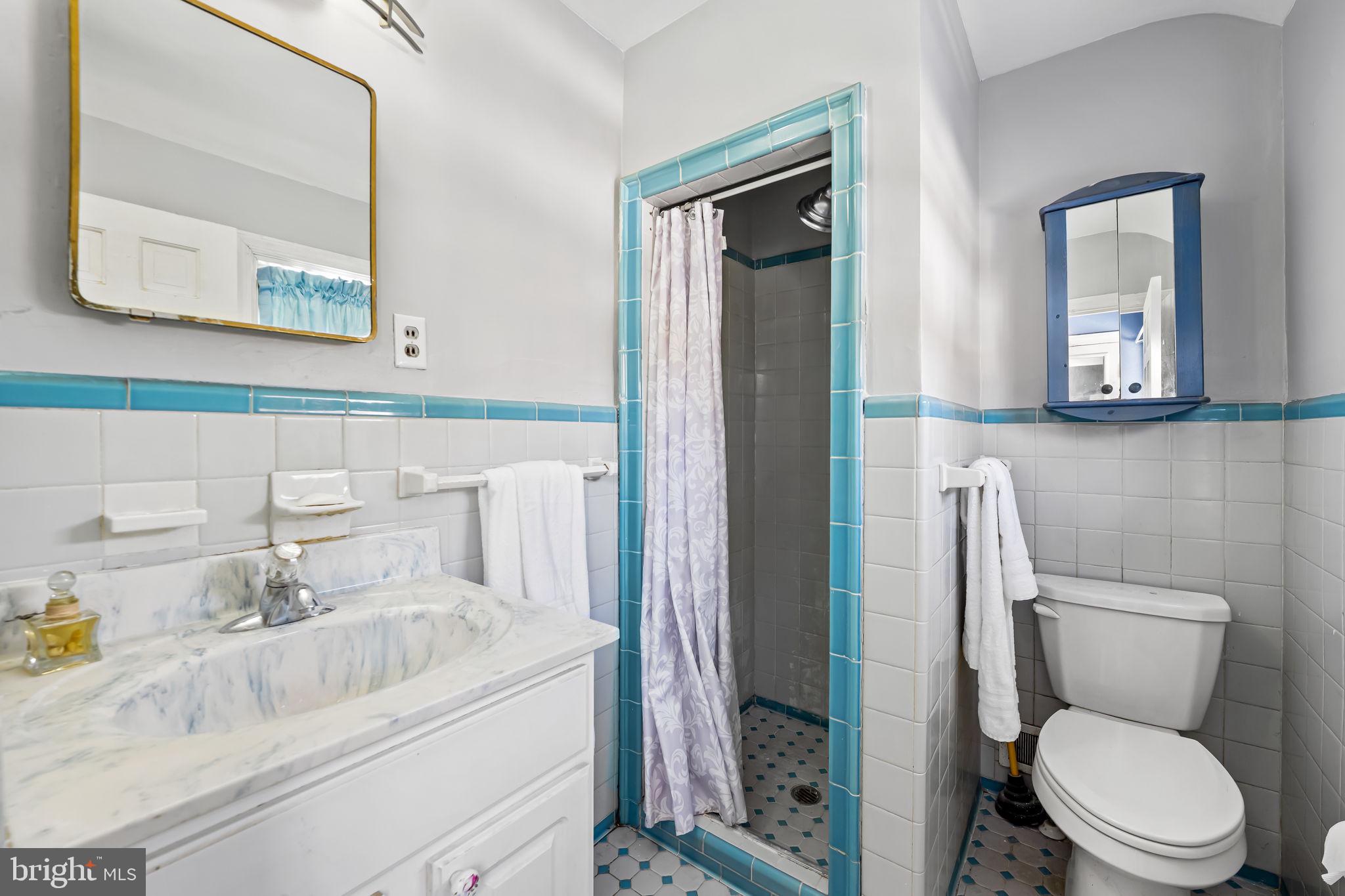 3022 Dunglow Road Baltimore, MD 21222 - Photo 24 of 45 a bathroom with a sink and a toilet