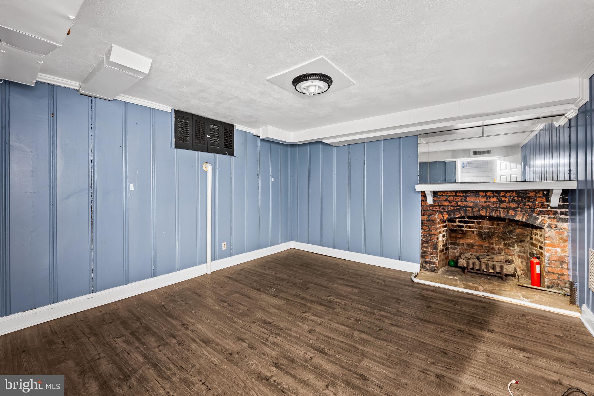 3022 Dunglow Road Baltimore, MD 21222 - Photo 35 of 45 a view of a livingroom with wooden floor