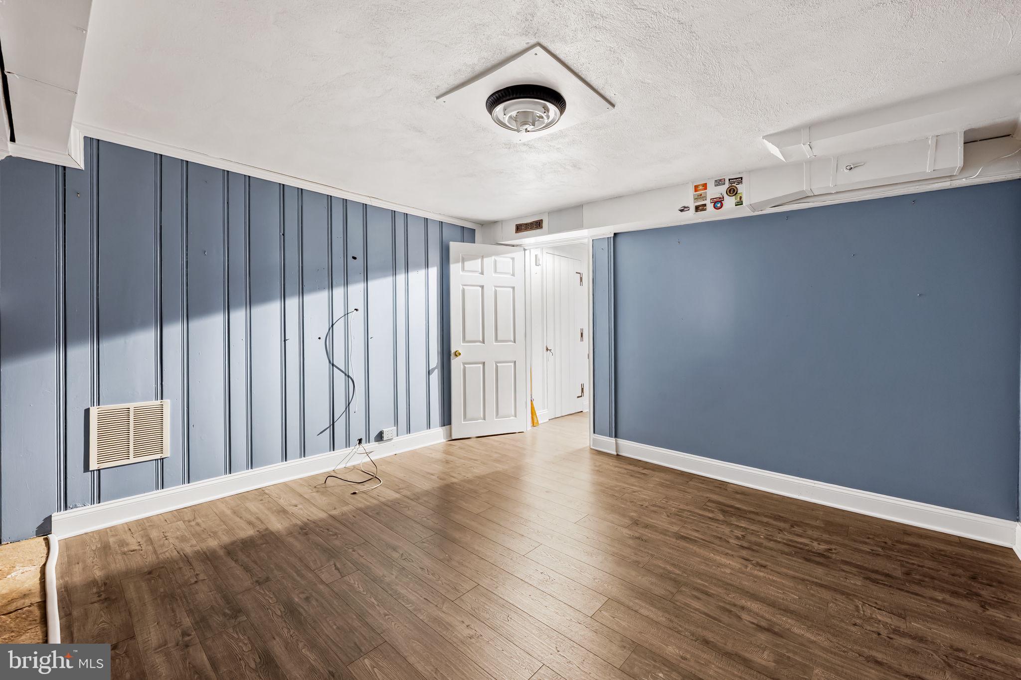 3022 Dunglow Road Baltimore, MD 21222 - Photo 36 of 45 a view of an empty room with wooden floor