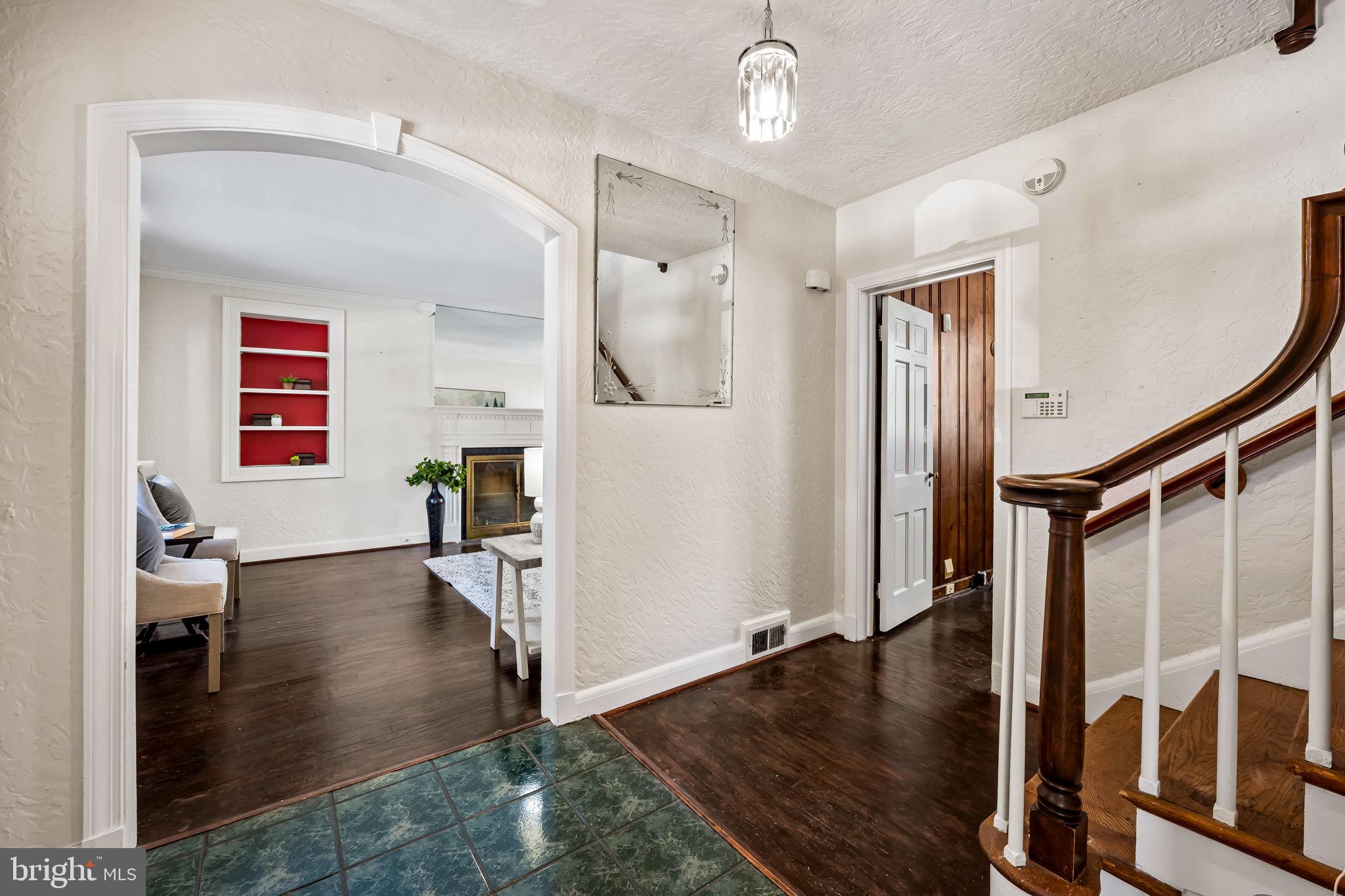 3022 Dunglow Road Baltimore, MD 21222 - Photo 4 of 45 a view of entryway with wooden floor and livingroom view
