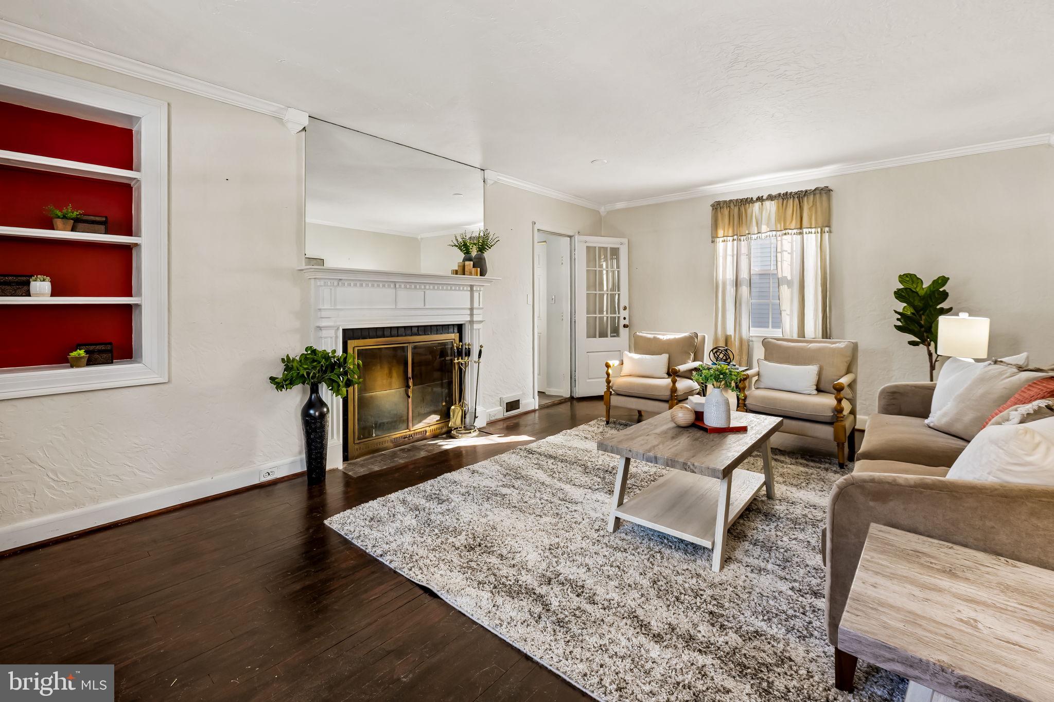 3022 Dunglow Road Baltimore, MD 21222 - Photo 6 of 45 a living room with furniture and a fireplace
