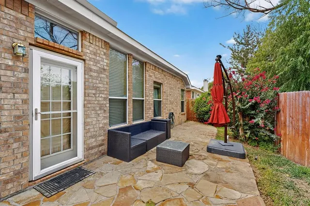 a backyard of a house with seating space
