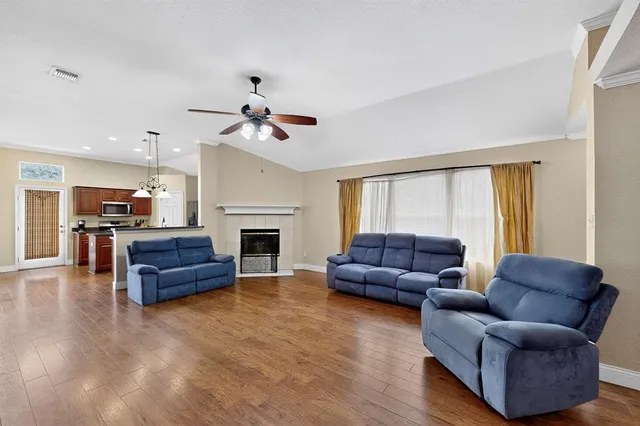 a living room with furniture and a fireplace