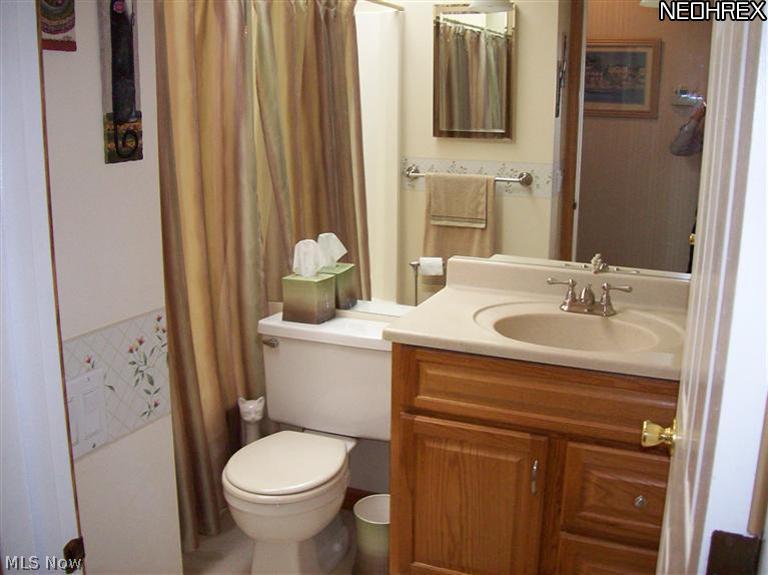 7555 Stone Road Medina, OH 44256 - Photo 11 of 25 Main full bathroom off the hallway. Newer vanity, faucet and sink. A skylight filters in a lot of natural light.