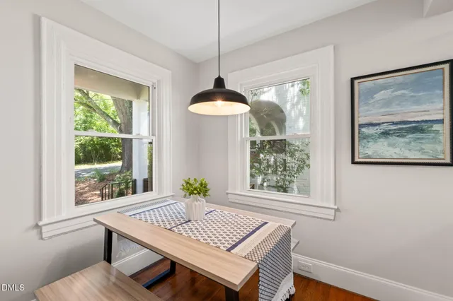 a view of a dining room with furniture window and wooden floor