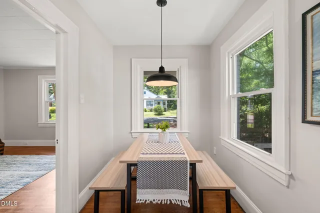 a view of a dining room with furniture window and outside view