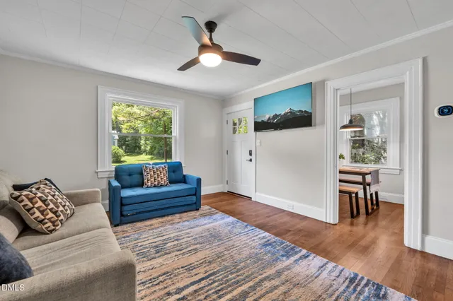 a living room with furniture and a window