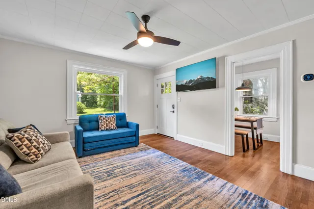a living room with furniture and a window