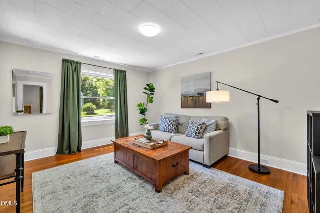 a living room with furniture and a rug
