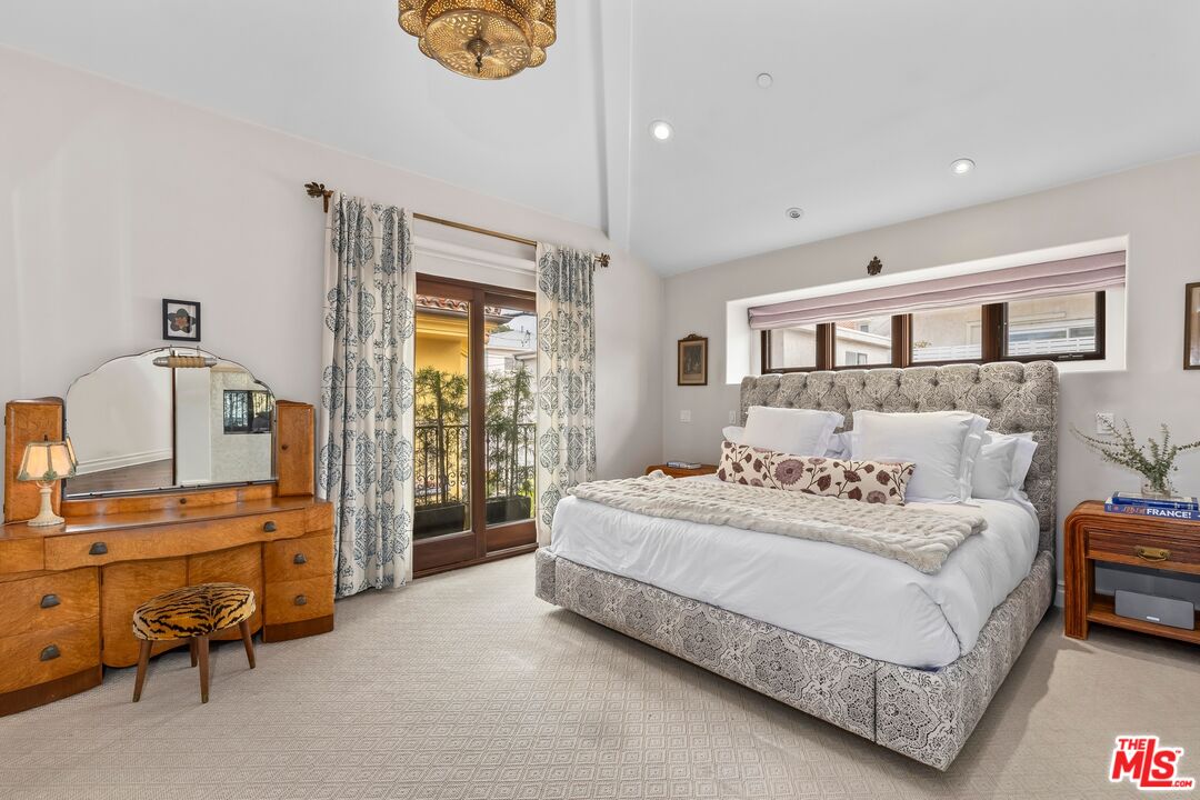 849 14th Street, Unit 8 Santa Monica, CA 90403 - Photo 7 of 19 a bedroom with a bed and a cabinets