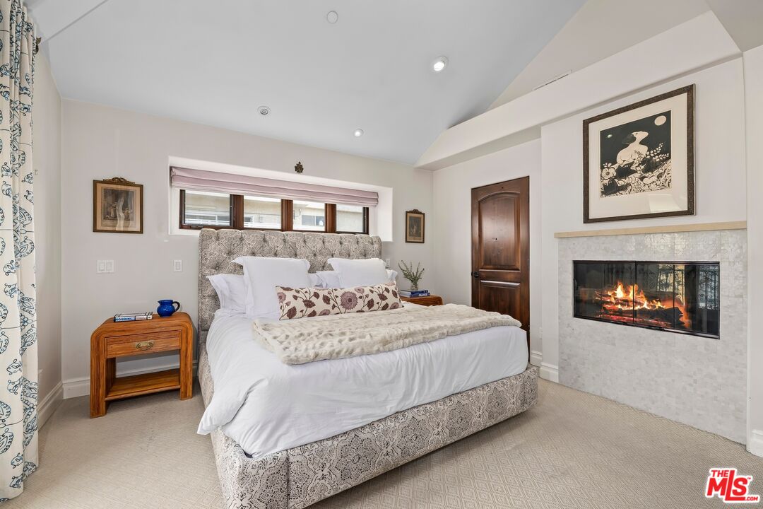 849 14th Street, Unit 8 Santa Monica, CA 90403 - Photo 8 of 19 a bedroom with a bed and a couch