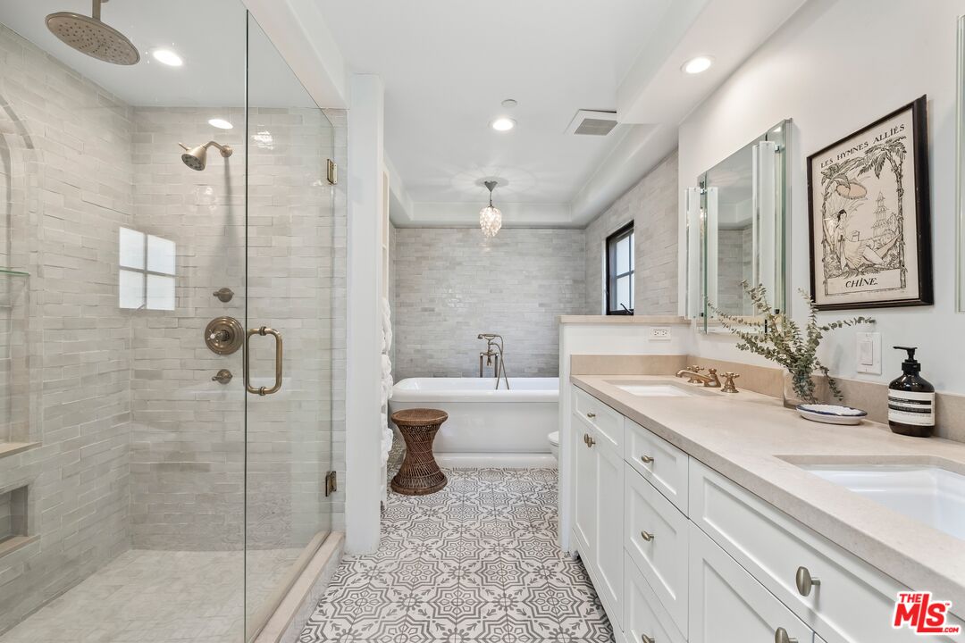 849 14th Street, Unit 8 Santa Monica, CA 90403 - Photo 9 of 19 a spacious bathroom with a double vanity sink mirror and shower