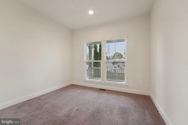 a bedroom with a bed and ceiling fan