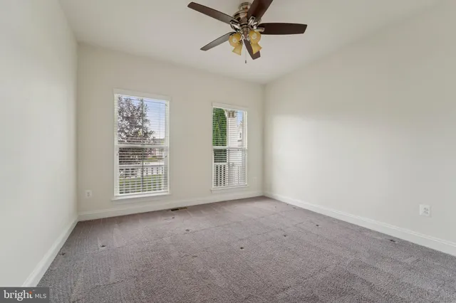 a en suite bathroom with a double vanity sink a mirror and a shower