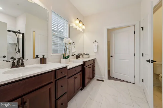 a view of an empty room with a lot of white walls