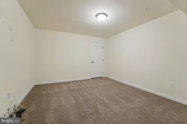 a aerial view of a house with yard and balcony