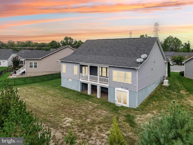 a aerial view of a house with swimming pool and outdoor space