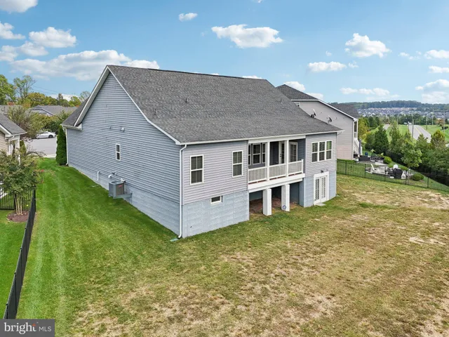 an aerial view of a house with a ocean view