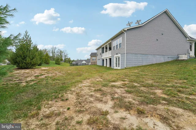 an aerial view of a house with a ocean view