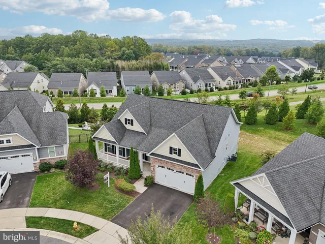 an aerial view of a house with outdoor space