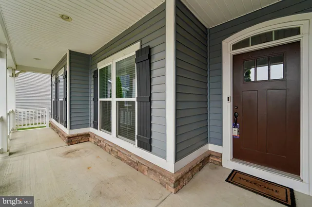 a view of front door and bedroom