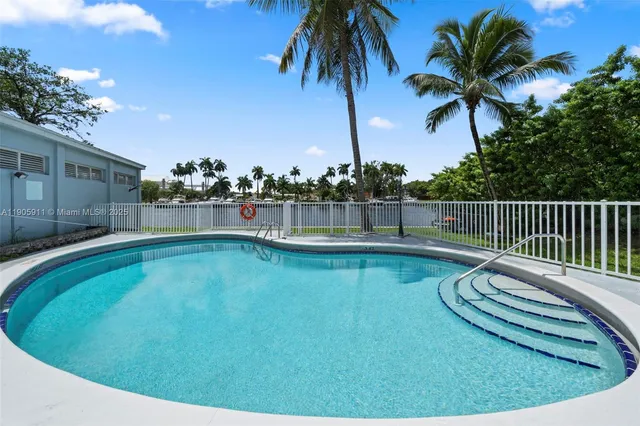 a view of a swimming pool with a lounge chair