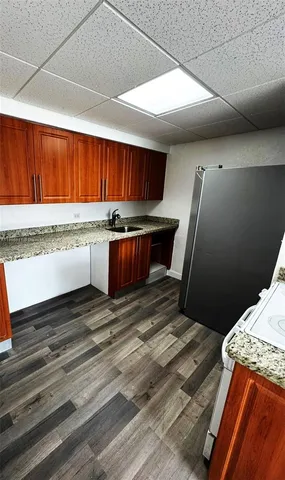a view of kitchen with a sink and a dishwasher