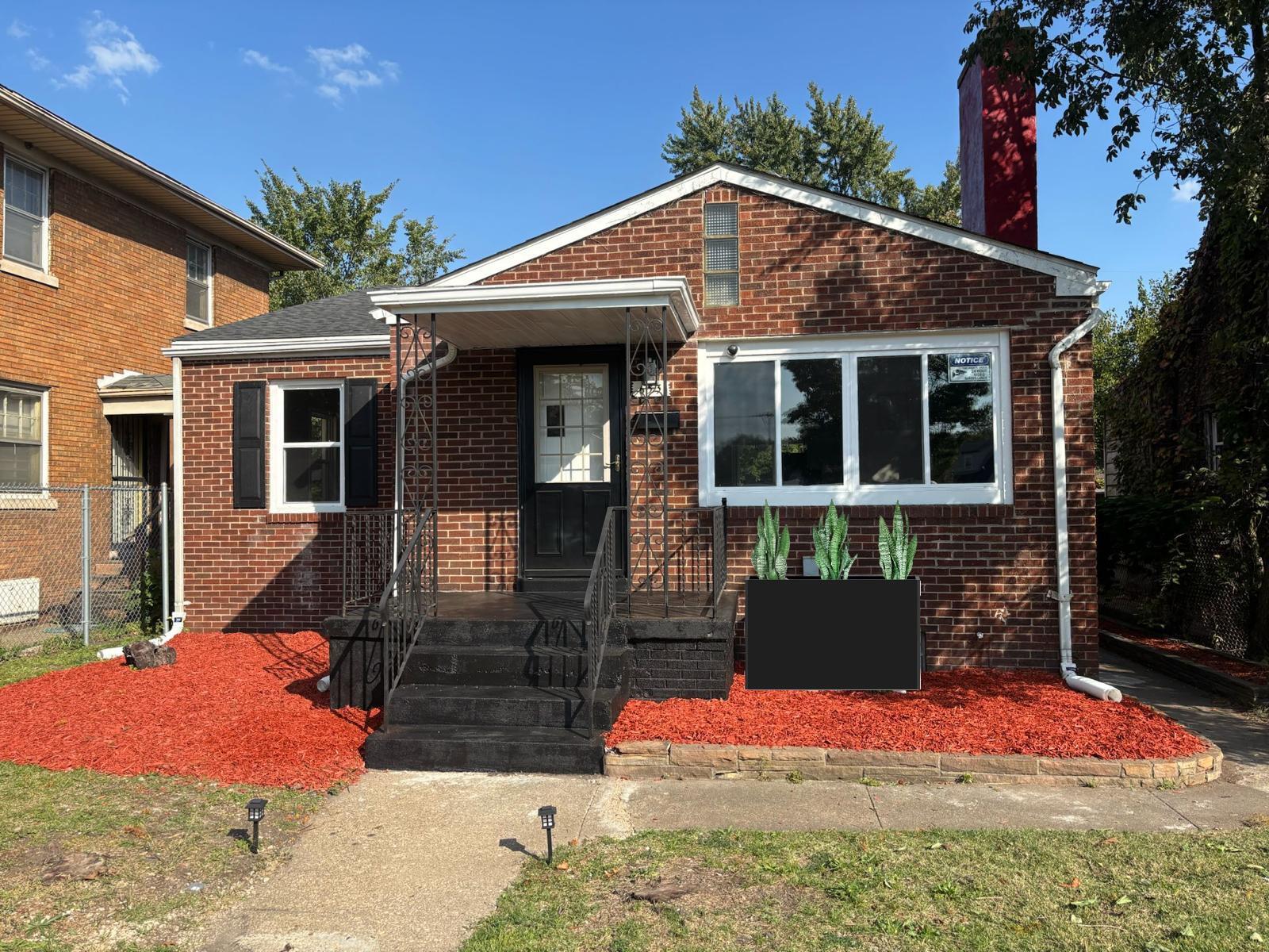 653 West Taft Street Gary, IN 46404 - Photo 1 of 16 a front view of a house with a yard