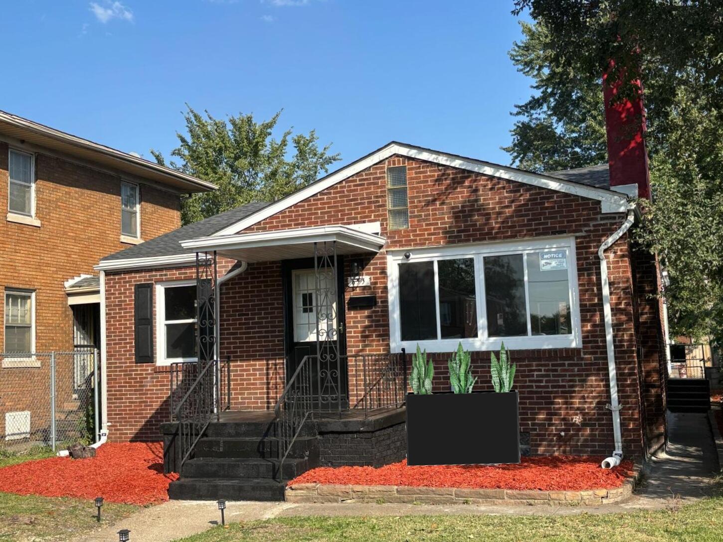 653 West Taft Street Gary, IN 46404 - Photo 2 of 16 a front view of a house with yard