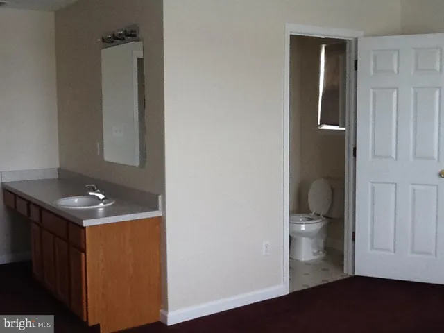 a view of hallway with livingroom