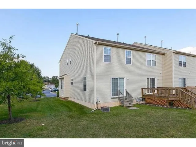 a view of a backyard with plants and garden