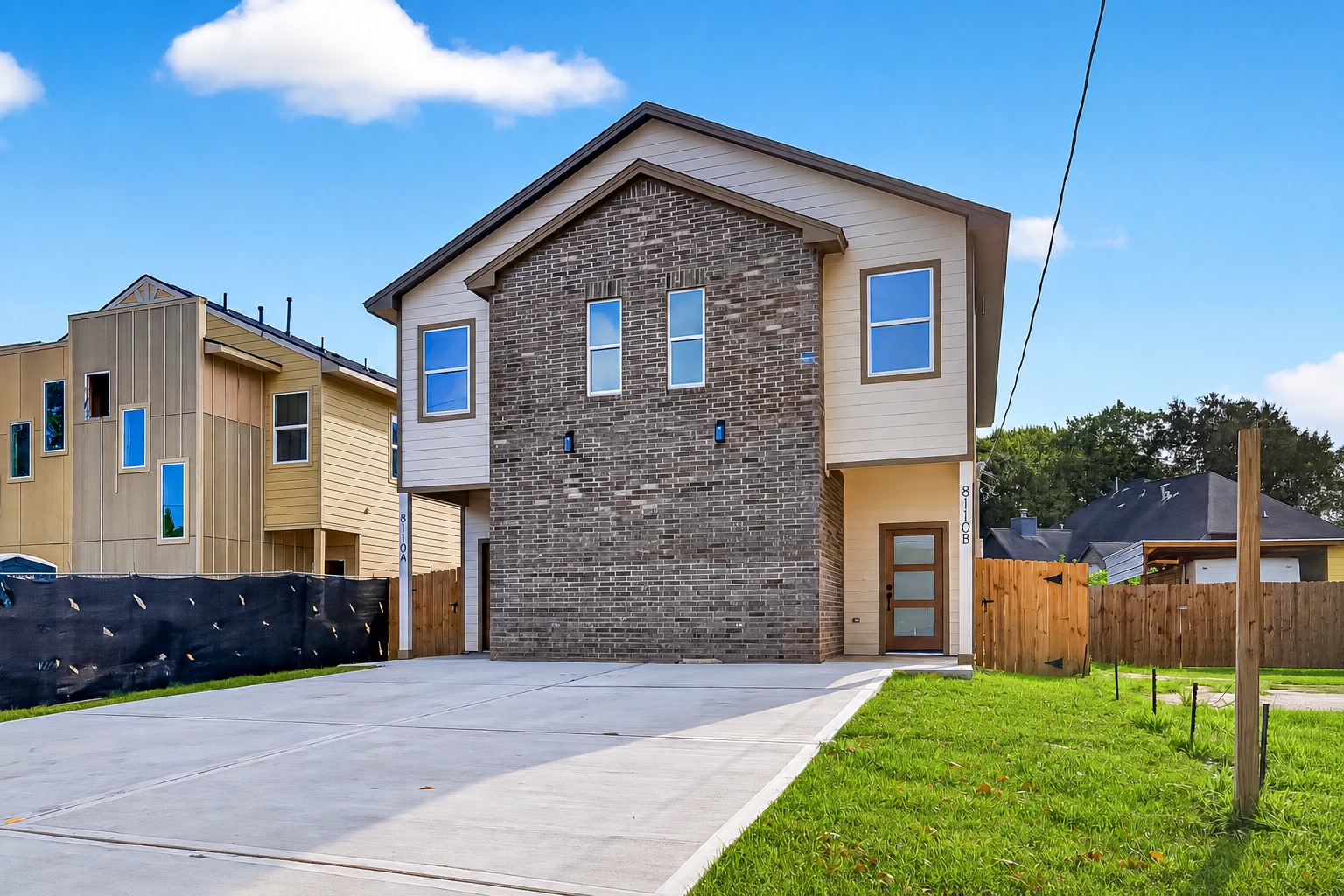 8110 Carver Road Houston, TX 77088 - Photo 2 of 38 Thoughtfully designed exterior with a classic brick centerpiece that adds character and creates a strong, balanced look from the street.
