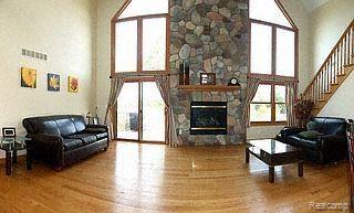 5866 Hay Rake Hollow Gregory, MI 48137 - Photo 10 of 15 Great Room With Fireplace