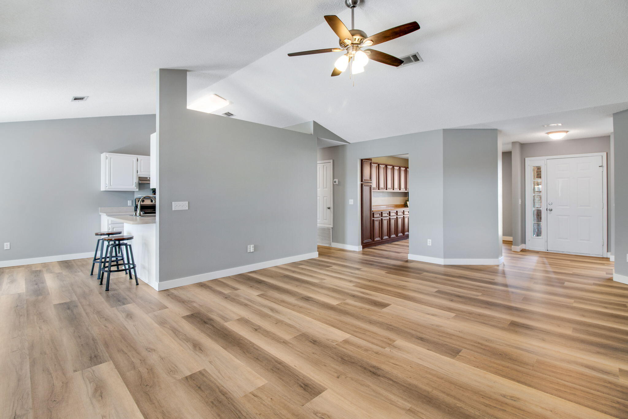 5130 Whitehurst Lane Crestview, FL 32536 - Photo 12 of 49 a view of empty room with wooden floor and fan